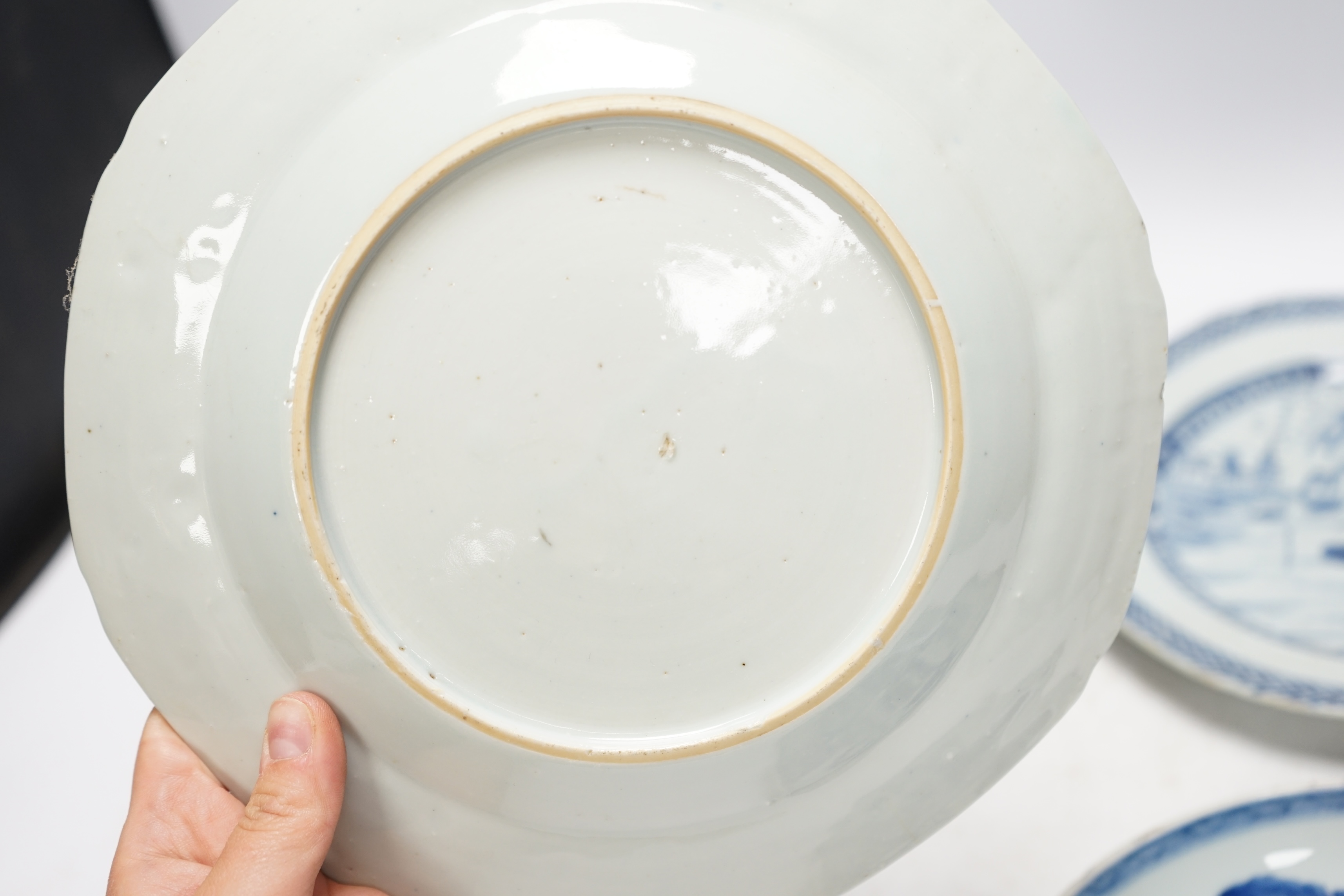 Four various Chinese export blue and white dishes, 18th/19th century, largest 26cm, largest 26cm diameter. Condition - one plate cracked, chips to another